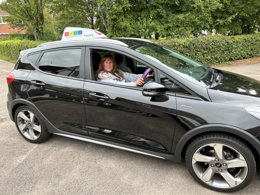 Hayley from DVDS learners in her driving school car.